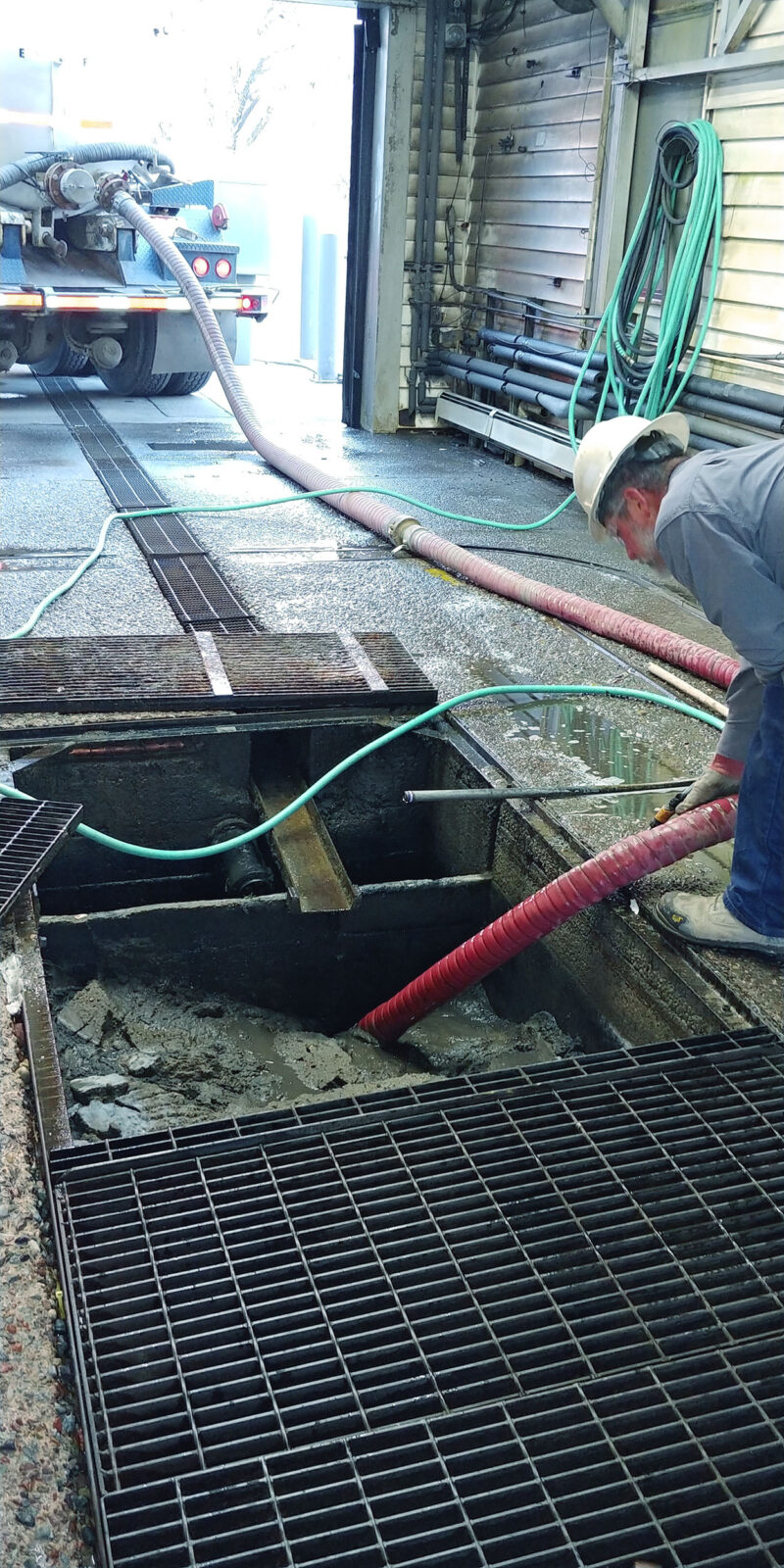 Cleaning car wash pits